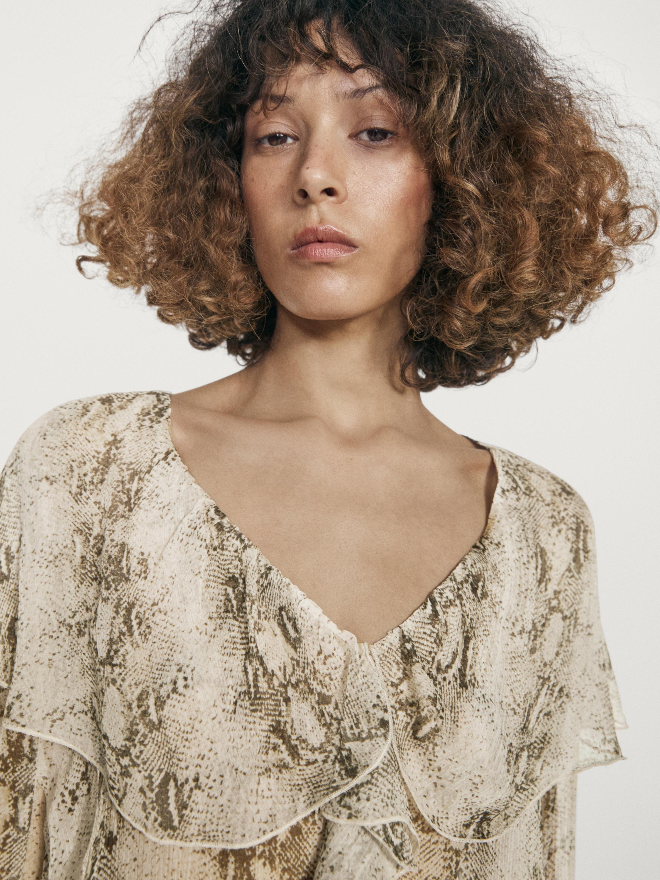 Snakeskin print blouse with ruffles